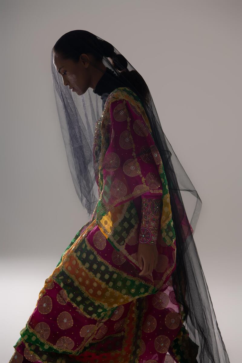 A striped silk kandurah with integrated thawb, circa 2011. Embellished with crystals and metallic threads, it was a gift to The Zay Initiative from Sheikha Fakhra Bint Saeed Al Nahyan, wife of Sheikh Nahyan bin Mubarak Al Nahyan.