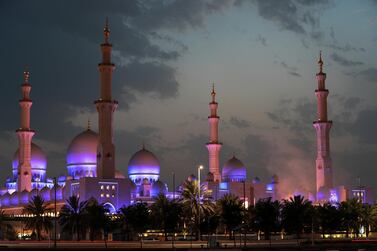 Ramadan in the UAE: Smoke rises from canons fired to mark the first moon sighting in 2018 at the Sheikh Zayed Grand Mosque in Abu Dhabi. Victor Besa / The National 