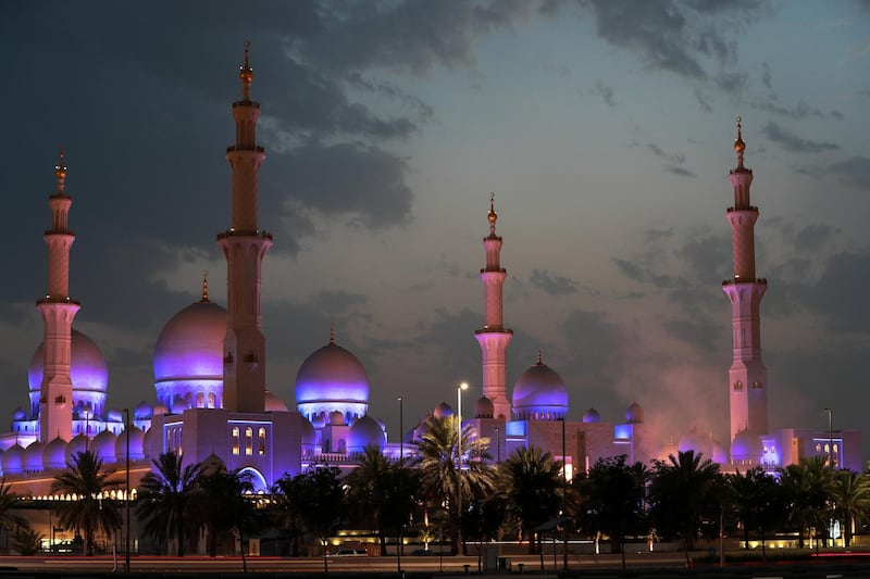 Abu Dhabi, UAE.  May 16, 2018.  Waiting for the moon to come out at the Sheikh Zayed Mosque.  Smoke from the canons fired to mark the first moon sighting.  (bottom right)
Victor Besa / The National
Section:  National