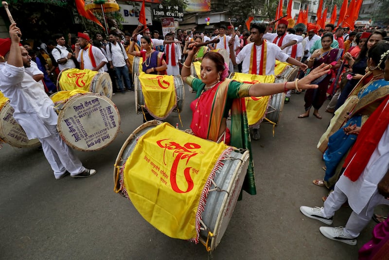 Participants play drums as they attend festivities in Mumbai. Reuters 