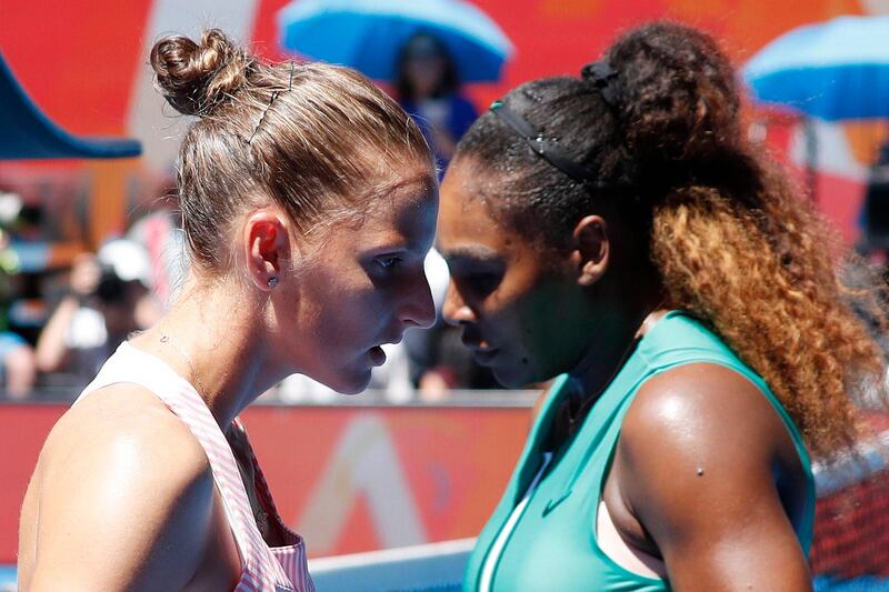 epa07310560 Karolina Pliskova (L) of Czech Republic and Serena Williams (R) of the United States pass each other during their women's singles quarter final match on day 10 of the Australian Open Grand Slam tennis tournament in Melbourne, Australia, 23 January 2019.  EPA/RITCHIE TONGO