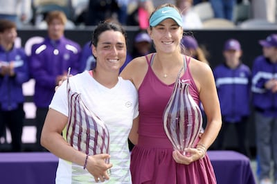Ons Jabeur of Tunisia and Belinda Bencic of Switzerland pose with their trophies at the Charleston Open. Getty via AFP