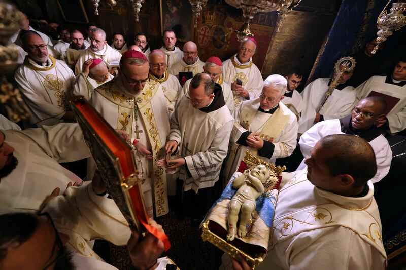 Pierbattista Pizzaballa, Latin Patriarch of Jerusalem, holds a midnight Christmas mass at the Church of the Nativity in the Palestinian town of Bethlehem. EPA