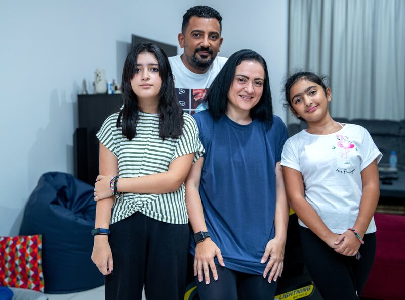 Mai Hamed with husband Amir and daughters, Jana,12, and Salma, 9. Victor Besa / The National
