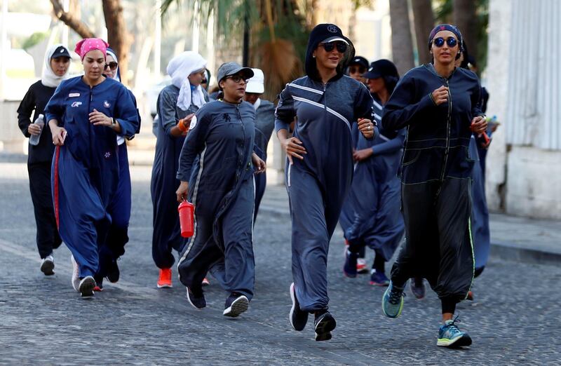 Women run during an event marking International Women's Day in Old Jeddah, Saudi Arabia March 8, 2018. REUTERS/Faisal Al Nasser