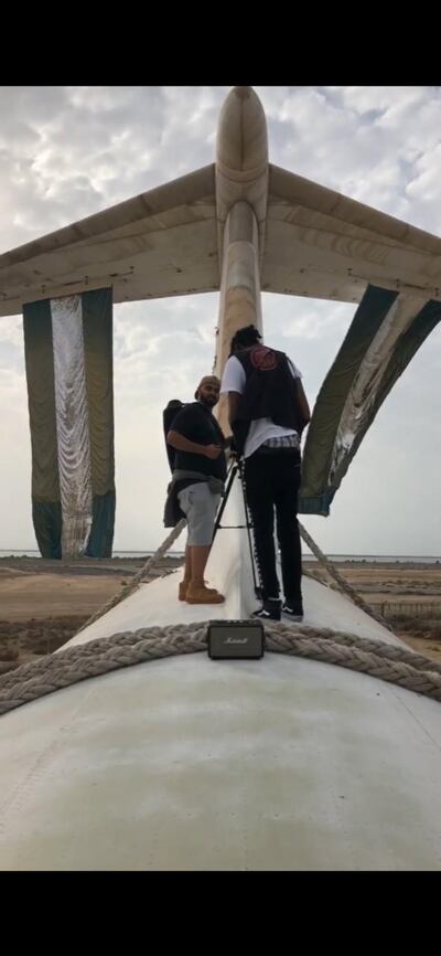 AIham Al Subaihi and Mustafa Ismail on top of the abandoned plane in Umm Al Quwain. Courtesy Aiham Al Subaihi 