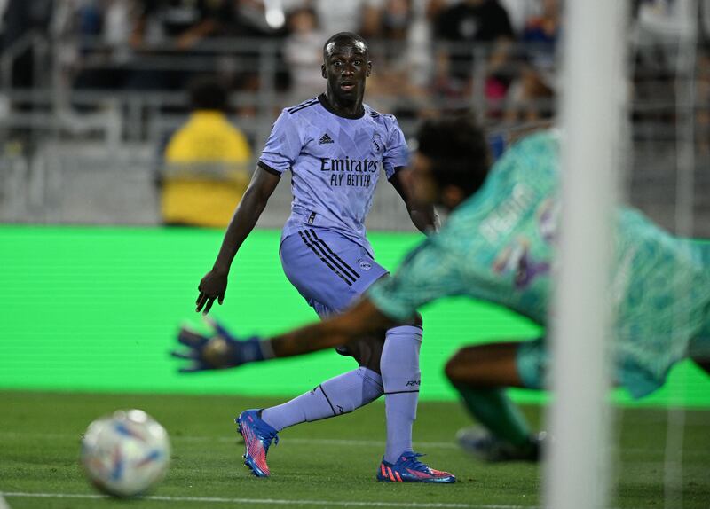 Real Madrid full-back Ferland Mendy eyes the ball during the friendly match between Real Madrid and Juventus. AFP