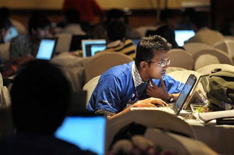 TO GO WITH India-Internet-spam-IT-crime,FOCUS by Phil Hazlewood

(FILES) In this file photo taken on July 25, 2010, Indian Information Technology (IT) professionals work on their laptops during an 'Open Hack Day' programme organised by the global search engine Yahoo! in Bangalore. 

India has emerged as the world's top source of junk mail as spammers make use of lax laws and absent enforcement to turn the country into a centre of unsolicited email. Kaspersky Lab, a Moscow-based global Internet security firm, says in a recent report that more spam was sent from the south Asian giant than anywhere else in the world in the third quarter of the year.    AFP PHOTO/Dibyangshu SARKAR/ FILES

