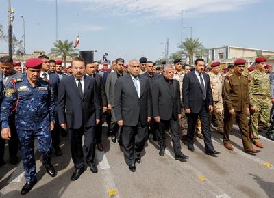 Iraqi Prime Minister Adel Abdul Mahdi and Hadi al-Amiri member of the Iraqi Parliament and Leader of Badr Organisation, attend a symbolic funeral ceremony of Major General Ali al-Lami, who commands the Iraqi Federal Police's Fourth Division, who was killed in Salahuddin, in Baghdad, Iraq October 23, 2019. REUTERS/Khalid al-Mousily