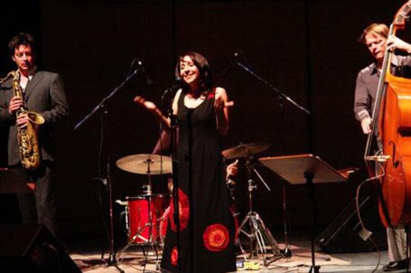 Rima Khcheich, singer, on stage with the Uri Honing Trio.