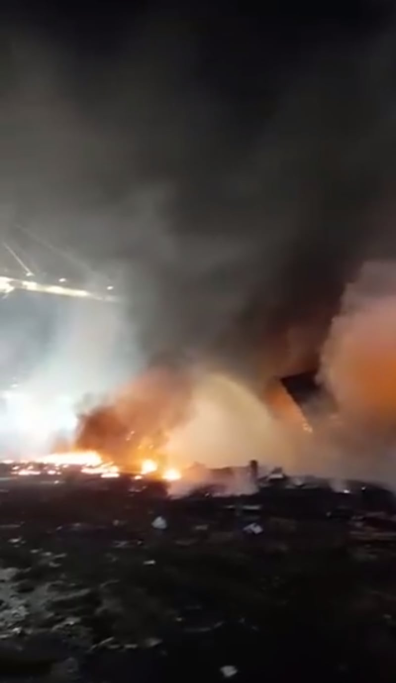 Fire fighters battle the blaze on a container ship in Dubai's Jebel Ali Port.