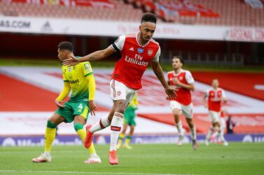 Soccer Football - Premier League - Arsenal v Norwich City - Emirates Stadium, London, Britain - July 1, 2020 Arsenal's Pierre-Emerick Aubameyang celebrates scoring their third goal, as play resumes behind closed doors following the outbreak of the coronavirus disease (COVID-19) Richard Heathcote/Pool via REUTERS EDITORIAL USE ONLY. No use with unauthorized audio, video, data, fixture lists, club/league logos or "live" services. Online in-match use limited to 75 images, no video emulation. No use in betting, games or single club/league/player publications. Please contact your account representative for further details.