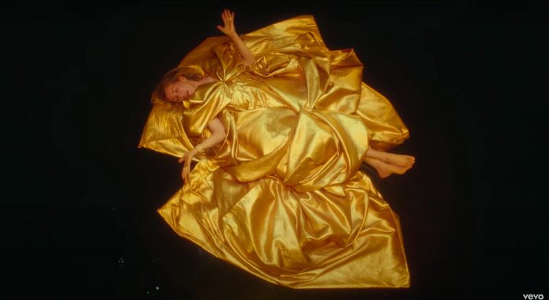 Ellie Goulding wears a couture gown by Ashi Studio in the video for 'Love I'm Given'. YouTube