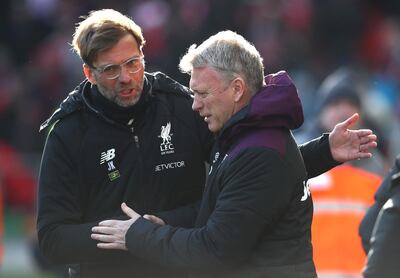 LIVERPOOL, ENGLAND - FEBRUARY 24:  Jurgen Klopp, Manager of Liverpool and David Moyes, Manager of West Ham United speak during the Premier League match between Liverpool and West Ham United at Anfield on February 24, 2018 in Liverpool, England.  (Photo by Clive Brunskill/Getty Images)