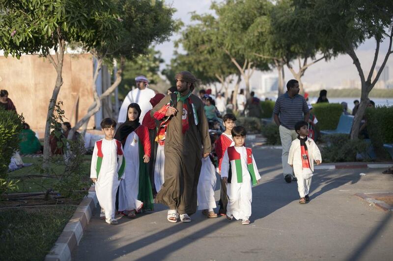 An Emirati family enjoy a day out at Ras Al Khaimah's Corniche to celebrate UAE National Day. Reem Mohammed / The National