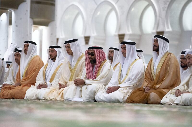 ABU DHABI, UNITED ARAB EMIRATES - June 15, 2018: (R-L) HE Shaykh Abdallah bin Bayyah , HH Sheikh Nahyan Bin Zayed Al Nahyan, Chairman of the Board of Trustees of Zayed bin Sultan Al Nahyan Charitable and Humanitarian Foundation, HH Lt General Sheikh Saif bin Zayed Al Nahyan, UAE Deputy Prime Minister and Minister of Interior, HH Sheikh Tahnoon bin Zayed Al Nahyan, UAE National Security Advisor, HH Sheikh Hazza bin Zayed Al Nahyan, Vice Chairman of the Abu Dhabi Executive Council, HH Sheikh Issa bin Zayed Al Nahyan, HH Sheikh Hamed bin Zayed Al Nahyan, Chairman of the Crown Prince Court of Abu Dhabi and Abu Dhabi Executive Council Member and HH Sheikh Abdullah bin Zayed Al Nahyan, UAE Minister of Foreign Affairs and International Cooperation, attend Eid Al Fitr prayers at the Sheikh Zayed Grand Mosque. 

( Hamad Al Kaabi / Crown Prince Court - Abu Dhabi )
---