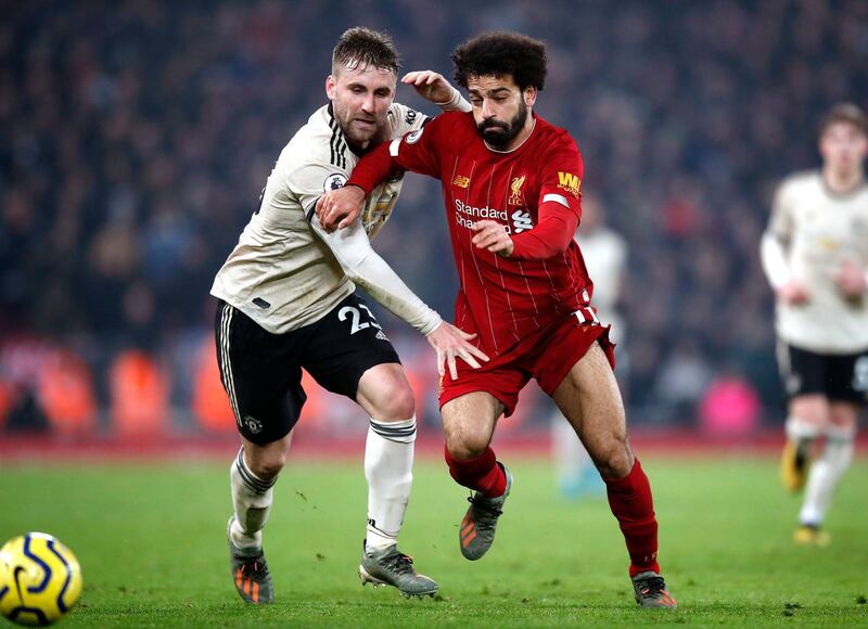 Liverpool's Mohamed Salah and Manchester United's Luke Shaw tussle for the ball. PA