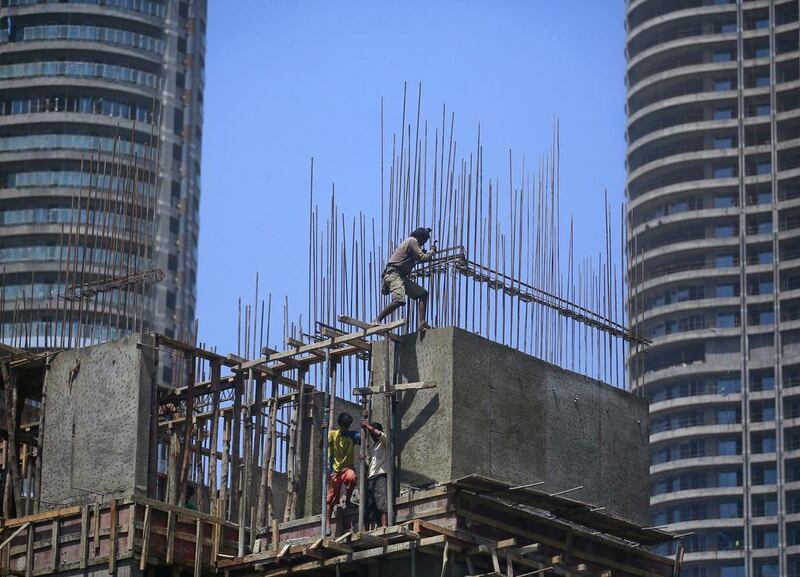 Labourers work at the construction site of a residential building in Mumbai’s central financial district. Danish Siddiqui / Reuters