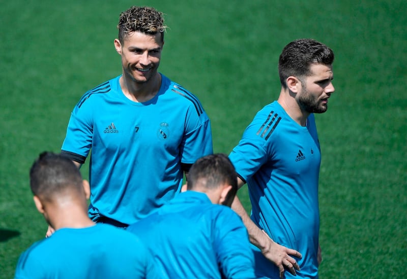 Real Madrid forward Cristiano Ronaldo and defender Nacho attend a training session. Gabriel Bouys / AFP