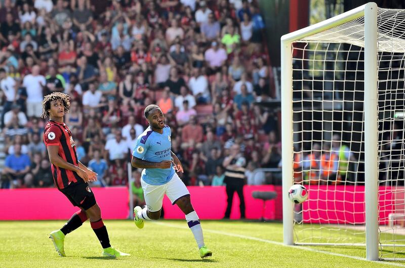 Manchester City's English midfielder Raheem Sterling (R) celebrates scoring his team's second goal during the English Premier League football match between Bournemouth and Manchester City at the Vitality Stadium in Bournemouth, southern England on August 25, 2019. (Photo by Glyn KIRK / AFP) / RESTRICTED TO EDITORIAL USE. No use with unauthorized audio, video, data, fixture lists, club/league logos or 'live' services. Online in-match use limited to 120 images. An additional 40 images may be used in extra time. No video emulation. Social media in-match use limited to 120 images. An additional 40 images may be used in extra time. No use in betting publications, games or single club/league/player publications. / 