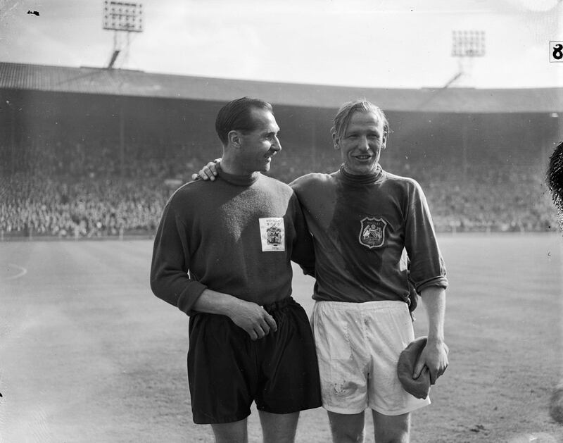 5th May 1956:  Merrick, the goalkeeper for Birmingham City and Trautmann, goalkeeper for Manchester City embrace at the end of the FA Cup Final Match at Wembley Stadium, London.  (Photo by PNA Rota/Getty Images)