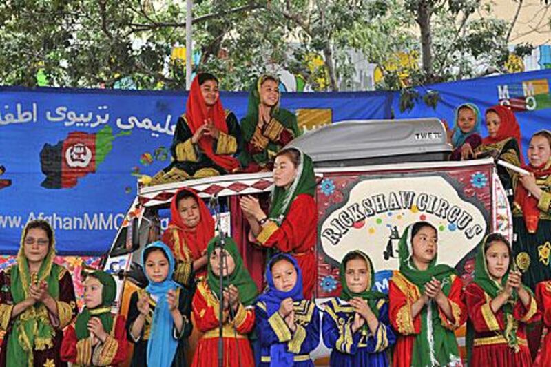 Afghan children from the Mobile Mini Circus for Children (MMCC) sing in Kabul.