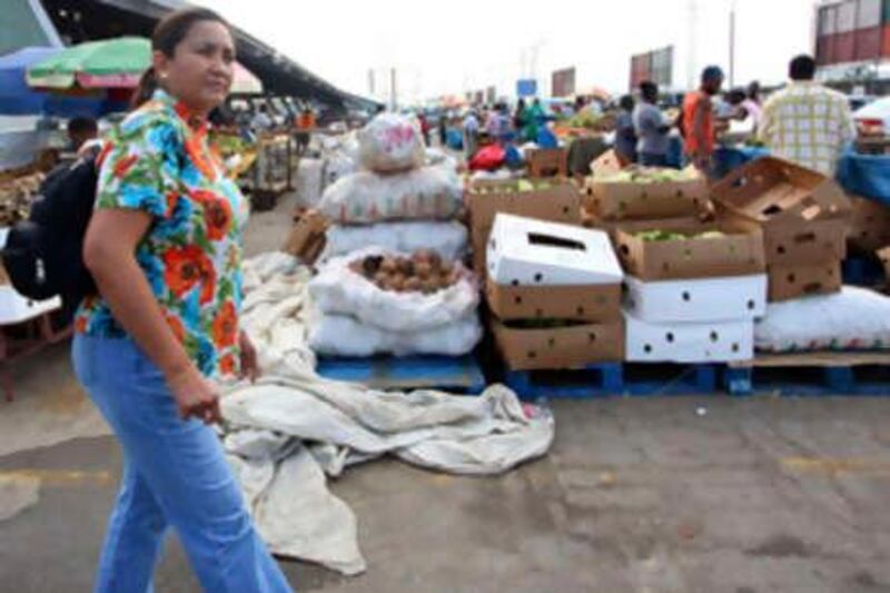 Josephine Jimenez, president of the Victoria 1522 investment fund, walks  through the Market Place in Port of Spain, Trinidad, April 15, 2010. Jimenez, a pioneering specialist in so-called frontier markets, visited Trinidad as part of a 10-country tour to scout out investment opportunities for her fund. Picture taken April 15, 2010.   To match Feature FRONTIERS/SPECIAL-REPORT    REUTERS/Andrea De Silva (TRINIDAD AND TOBAGO - Tags: BUSINESS SOCIETY)