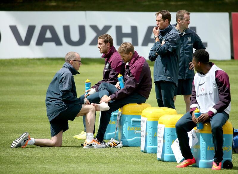 Steven Gerrard receives treatment on his foot during a training session at the England World Cup 2104 training session on Wednesday. Richard Heathcote / Getty Images / May 21, 2014