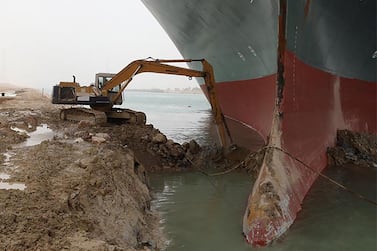 A handout picture released by the Suez Canal Authority on March 25, 2021 shows the Taiwan-owned MV Ever Given (Evergreen), a 400-metre- (1,300-foot-)long and 59-metre wide vessel, lodged sideways and impeding all traffic across the waterway of Egypt's Suez Canal. Egypt's Suez Canal Authority said it was "temporarily suspending navigation" until refloating of the MV Ever Given ship was completed on one of the busiest maritime trade routes. / AFP / Suez CANAL / - / == RESTRICTED TO EDITORIAL USE - MANDATORY CREDIT "AFP PHOTO / HO / Suez Canal" - NO MARKETING NO ADVERTISING CAMPAIGNS - DISTRIBUTED AS A SERVICE TO CLIENTS ==
