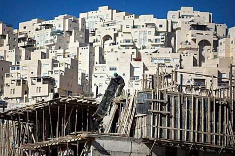 Construction work continues on a new housing unit in the east Jerusalem neighbourhood of Har Homa yesterday.