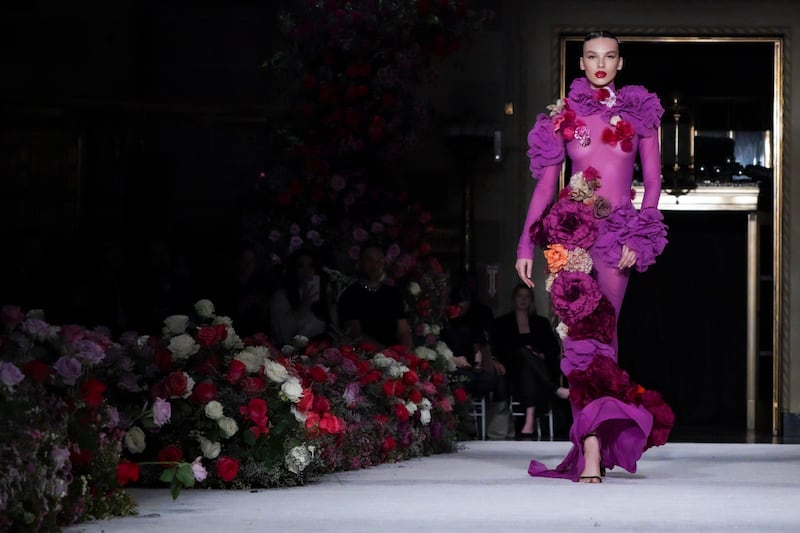 Siriano lined his runway with thousands of multicoloured flowers and put wide-brimmed hats worthy of muse Audrey Hepburn. AP Photo