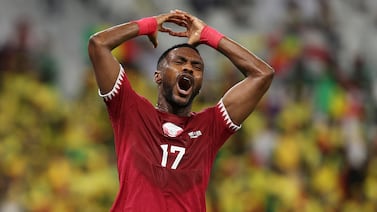 DOHA, QATAR - NOVEMBER 25: Ismail Mohamad of Qatar reacts after a missed chance during the FIFA World Cup Qatar 2022 Group A match between Qatar and Senegal at Al Thumama Stadium on November 25, 2022 in Doha, Qatar. (Photo by Dean Mouhtaropoulos / Getty Images)