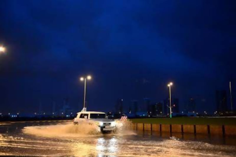 Motorists stopped to take pictures of the mountain rain causing a bad traffic jam on the Dubai-Fujairah road.