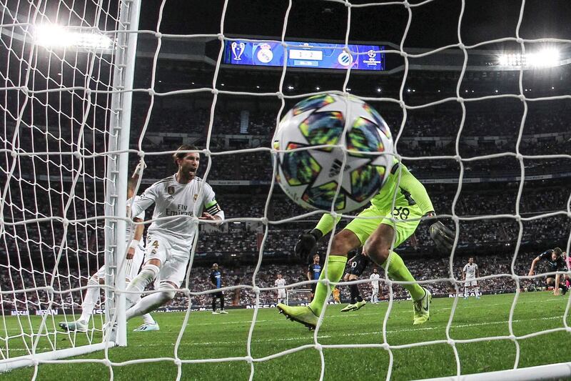 Real Madrid's defender Sergio Ramos (L) scores the 1-2 during the UEFA Champions League group A match between Real Madrid and Club Brugge at Santiago Bernabeu in Madrid, Spain.  EPA