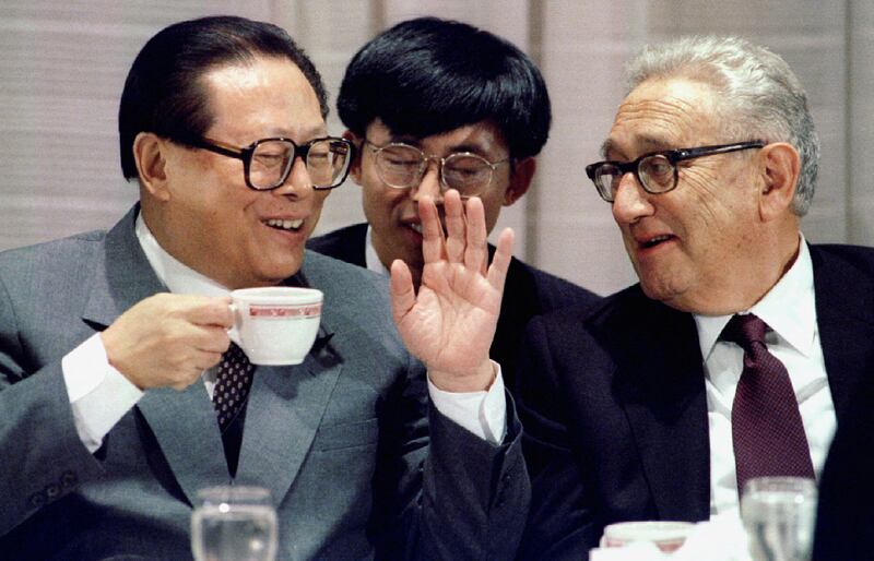 Chinese president Jiang Zemin with Mr Kissinger in New York, in 1995. Reuters