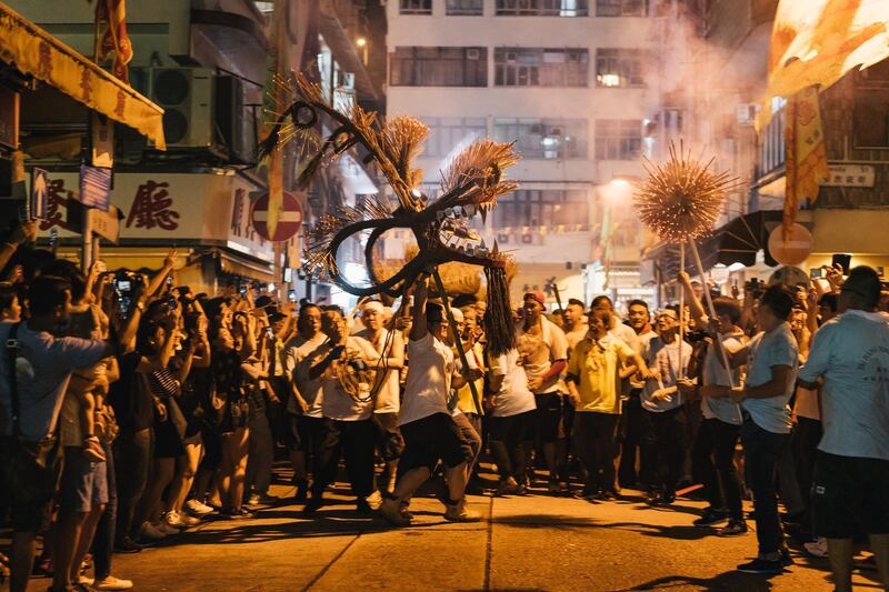 Members of the fire dragon dance team perform the Fire Dragon Dance to celebrate the Mid-Autumn Festival.