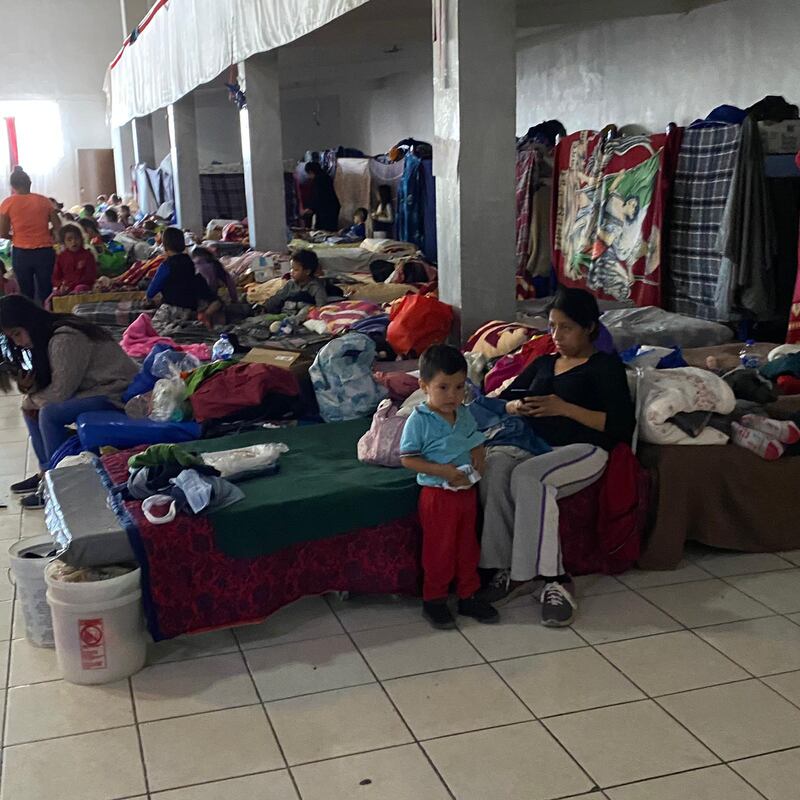 A woman and child sit on a bed inside the Ambassador Jesus Christ Shelter in Tijuana, Mexico. The shelter is currently housing 1,200 migrants. Photo courtesy of Felicia Rangel-Samponaro