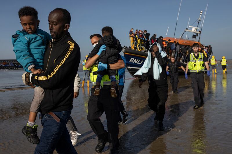 A group of migrants arrive on Dungeness beach in Kent, south-east England. The week has seen a major increase in migrant numbers due to fair weather. Getty Images