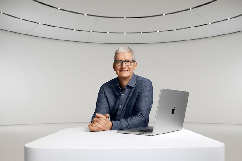 Apple chief executive Tim Cook poses with a new MacBook Pro at the Apple Special Event at Apple Park in Cupertino, California. Photo: AFP