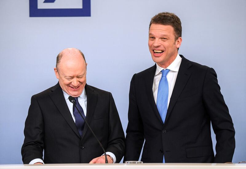 John Cryan, chief executive officer of Deutsche Bank AG, left, and Christian Sewing, deputy chief executive officer of Deutsche Bank AG, react during a fourth quarter results news conference in Frankfurt, Germany, on Friday, Feb. 2, 2018. Germany’s largest lender just closed out another year in the red, with revenue that declined to the lowest in seven years in the fourth quarter. Photographer: Andreas Arnold/Bloomberg