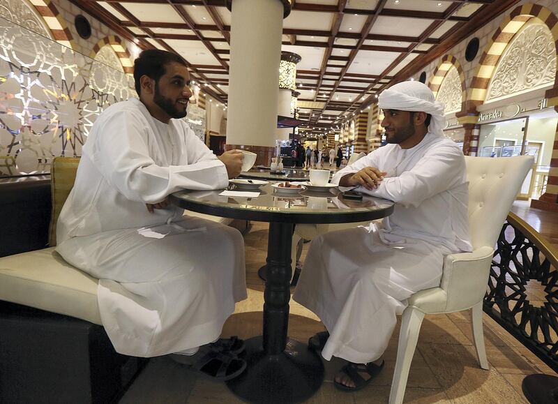 Dubai, May 26, 2018: (L) Mohammed Al Hashmi and (R) Rashed Al Mallah at the coffee shop after the iftar at the Dubai Mall in Dubai. Satish Kumar for the National / Story by Nawal