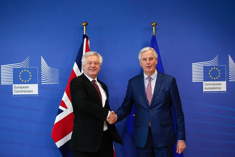 David Davis, U.K. exiting the European Union (EU) secretary, left, and Michel Barnier, chief negotiator for the European Union (EU), pose for a photograph ahead of Brexit negotiations in Brussels, Belgium, on Monday, March 19, 2018. As Brexit talks enter a crucial phase this week, pound traders are cautiously waiting for signs of progress toward a transition deal. Even if those expectations are met, any gains in the currency may be short-lived. Photographer: Dario Pignatelli/Bloomberg