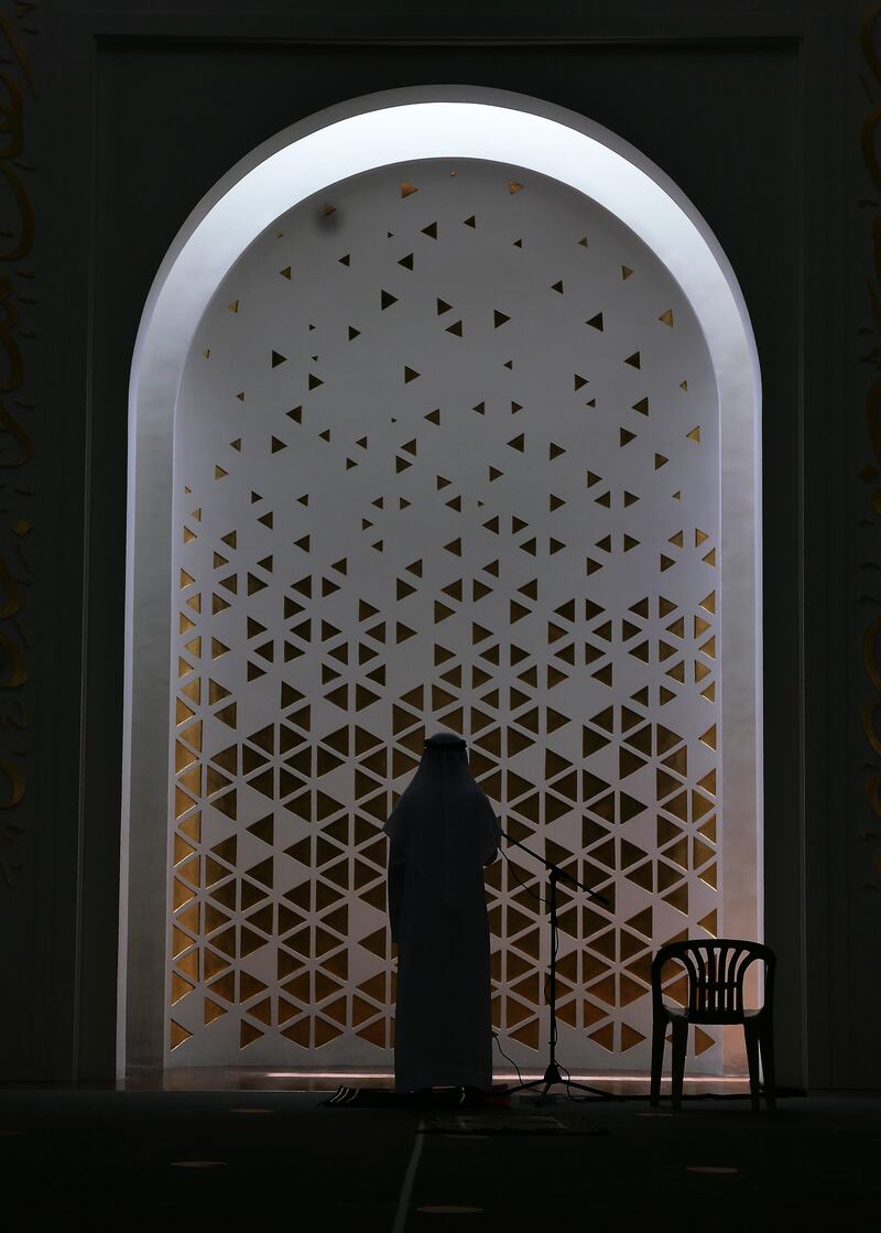 The imam during prayer at the Mosque of Light in Dubai.
