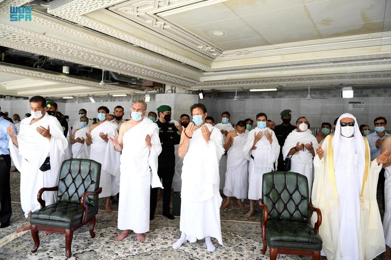 Pakistan's Prime Minister Imran Khan performs Umrah on Ramadan 27 with other members of his office, at the Grand Mosque, in Makkah, Saudi Arabia.