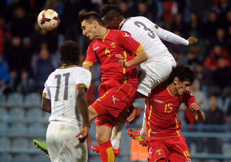 Asamoah Gyan (No 3) and Ghana lost to Montenegro 1-0. They'll play in Group G at the 2014 World Cup with Germany, Portugal and United States. Risto Bozovic / AP