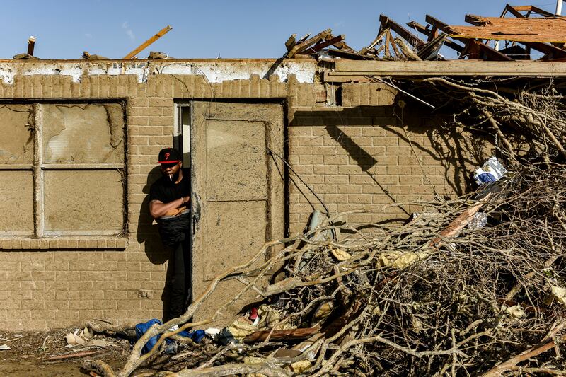 A Silver City resident surveys the damage. AP