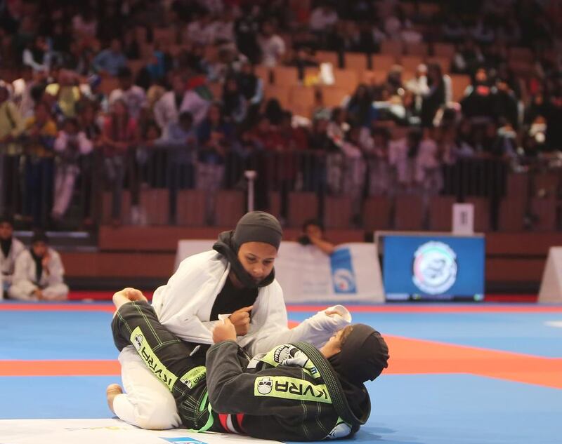 Alia Mohammed Salem (on top) of the UAE shown in her match with Lolwa al Shamsi of the UAE in the Abu Dhabi World Youth Jiu-Jitsu Championship 2016. Ravindranath / The National