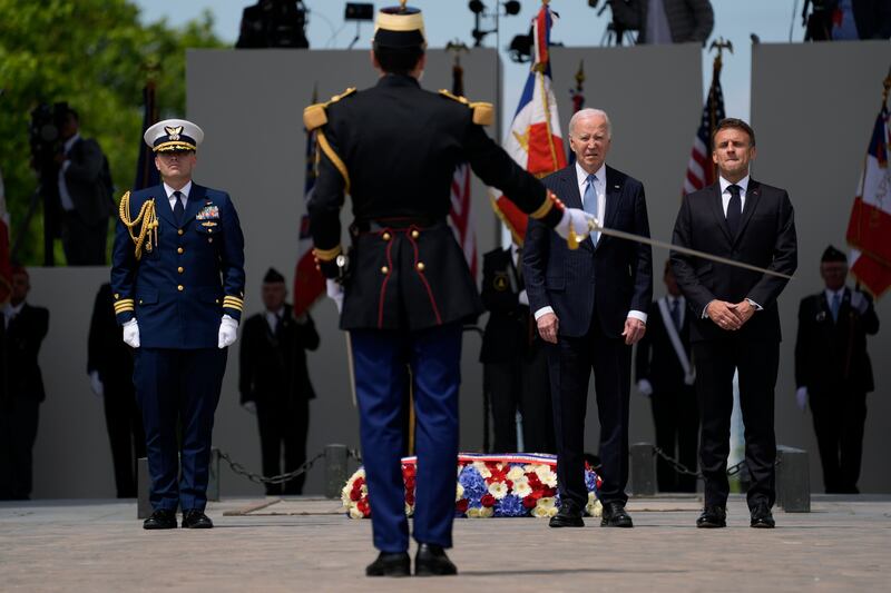 French President Emmanuel Macron and US leader Joe Biden stand by the Tomb of the Unknown Soldier during a ceremony at the Arc de Triomphe in Paris. AP Photo