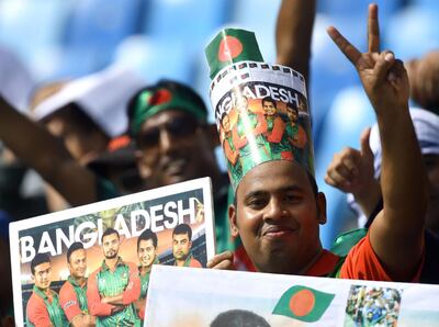 Bangladeshi cricket fans cheer in support of their national team during the one day international (ODI) Asia Cup cricket match between Bangladesh and Sri Lanka at the Dubai International Cricket Stadium in Dubai on September 15, 2018. / AFP / ISHARA S. KODIKARA
