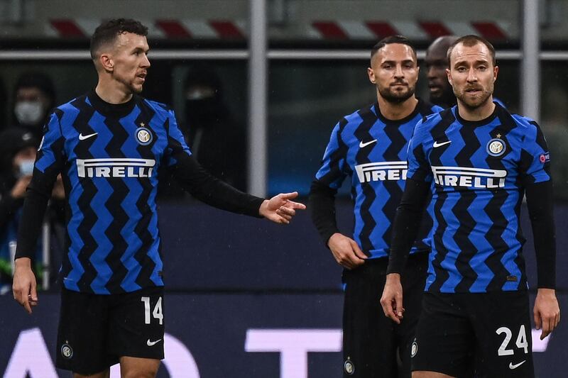Left to right: Inter Milan's Ivan Perisic, Danilo D'Ambrosio and Inter Christian Eriksen at the end of the game. AFP